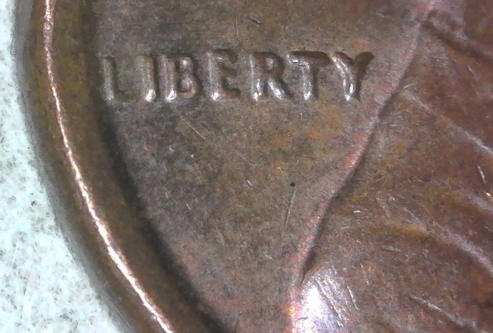 1973-D-Lincoln-Memorial-Cent-With-Retained-Collar-Break